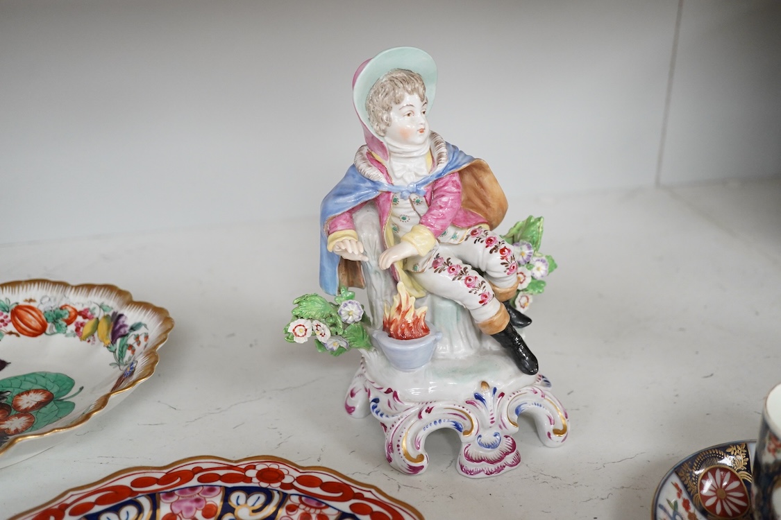 A Worcester Queen Charlotte pattern plate, Worcester scale blue coffee cup and teabowl, two French porcelain scale blue saucers, a fruit painted oval dish and a model of a boy emblematic of winter-19cm high
